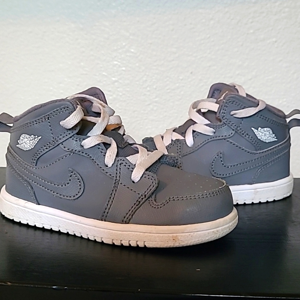 Toddler, grey and white, high top, Air Jordan tennis shoes.